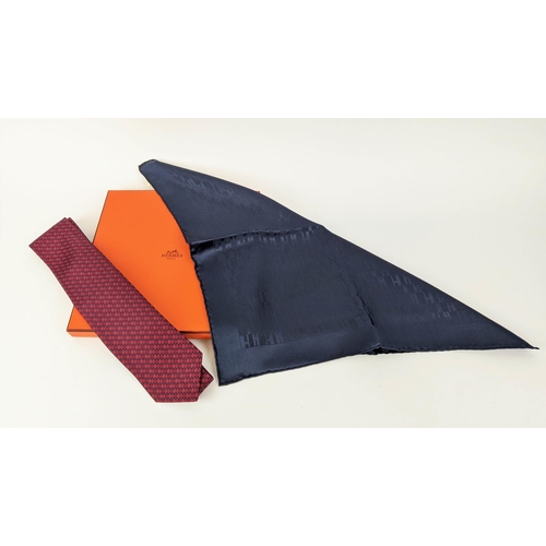 28 - HERMÈS POCHETTE MARINE FACONNEE GRAND H, silk, 45cm with box and a tie twill, silk. (2)