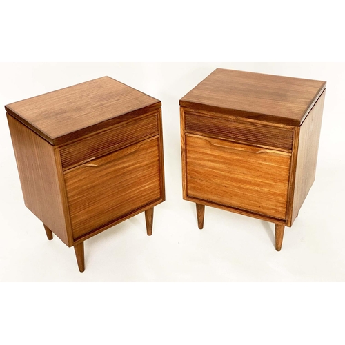 287 - BEDSIDE/LAMP CABINETS, a pair, 1970's teak each with drawer and cupboard in the manner of Richard St... 