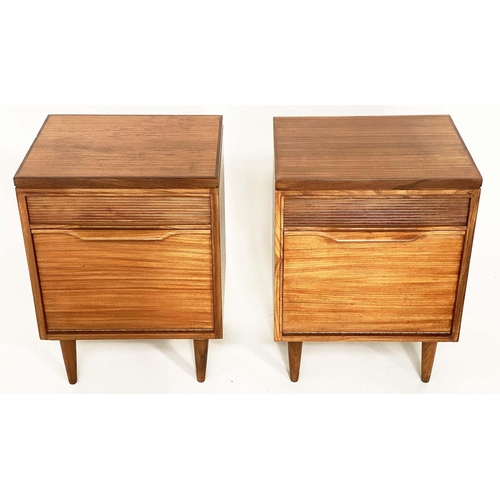 287 - BEDSIDE/LAMP CABINETS, a pair, 1970's teak each with drawer and cupboard in the manner of Richard St... 