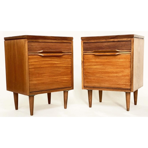 287 - BEDSIDE/LAMP CABINETS, a pair, 1970's teak each with drawer and cupboard in the manner of Richard St... 