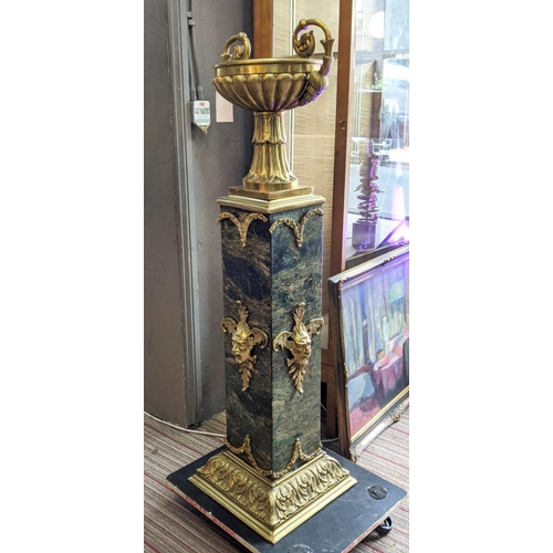 343 - URN ON STAND, marble and gilt metal, 133cm H.