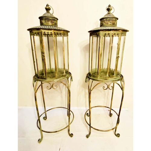 353 - FLOOR STANDING LANTERNS, a pair, 120cm high, 36cm diameter, French provincial style glazed sides, gi... 