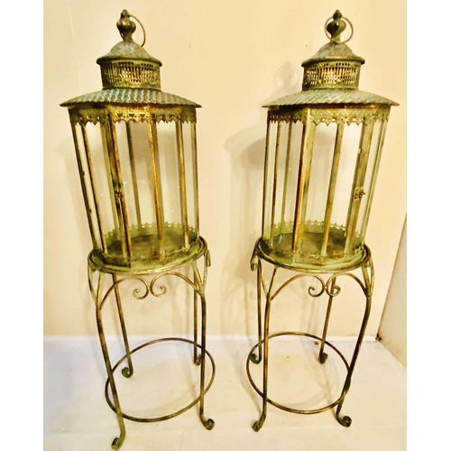 353 - FLOOR STANDING LANTERNS, a pair, 120cm high, 36cm diameter, French provincial style glazed sides, gi... 