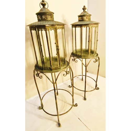 353 - FLOOR STANDING LANTERNS, a pair, 120cm high, 36cm diameter, French provincial style glazed sides, gi... 