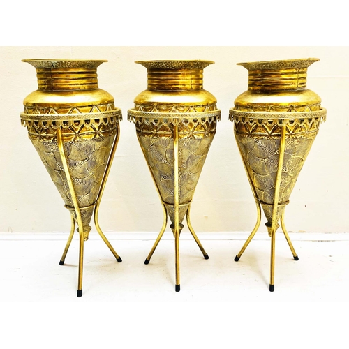 355 - VASES ON STANDS, set of three, tapered form, textured gilt metal, 58cm high, 22cm diameter. (3)