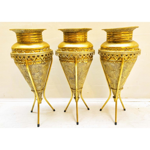 355 - VASES ON STANDS, set of three, tapered form, textured gilt metal, 58cm high, 22cm diameter. (3)