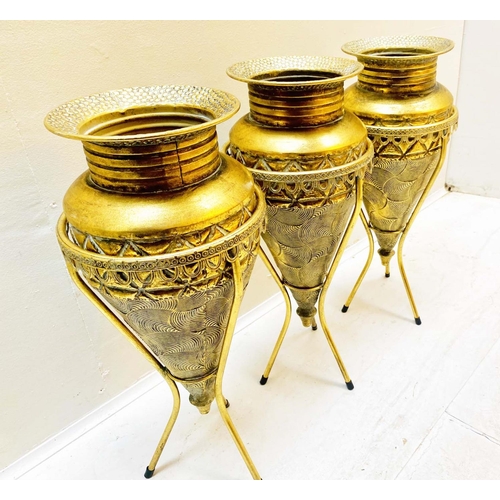 355 - VASES ON STANDS, set of three, tapered form, textured gilt metal, 58cm high, 22cm diameter. (3)