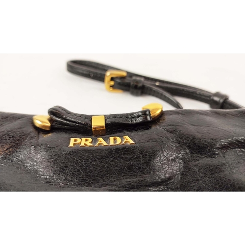 39 - PRADA VINTAGE WRISTLET CLUTCH, with bow front detail, gold tone hardware, top zip closure, adjustabl... 