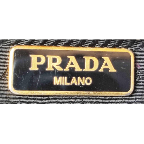 39 - PRADA VINTAGE WRISTLET CLUTCH, with bow front detail, gold tone hardware, top zip closure, adjustabl... 