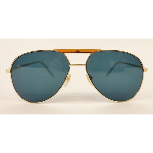 6 - GUCCI SUNGLASSES, gold tone and mother of pearl style arms, with amber coloured front detailing, wit... 