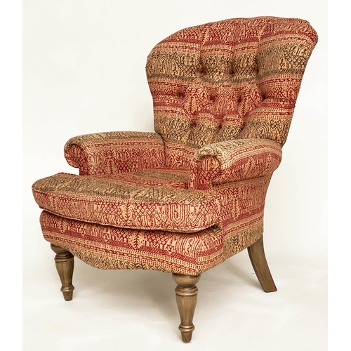 146 - ARMCHAIR, Victorian style deep buttoned spoon back, with Indian print upholstery.