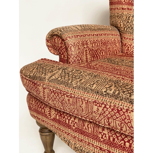 146 - ARMCHAIR, Victorian style deep buttoned spoon back, with Indian print upholstery.