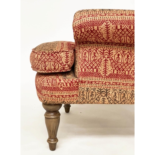 146 - ARMCHAIR, Victorian style deep buttoned spoon back, with Indian print upholstery.