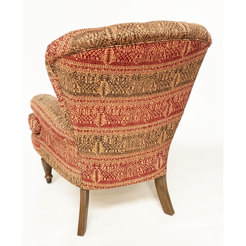 146 - ARMCHAIR, Victorian style deep buttoned spoon back, with Indian print upholstery.