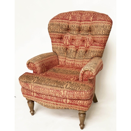 146 - ARMCHAIR, Victorian style deep buttoned spoon back, with Indian print upholstery.