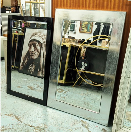 439 - WALL MIRRORS, two differing one with a silvered frame, another black lacquered, both with bevelled p... 