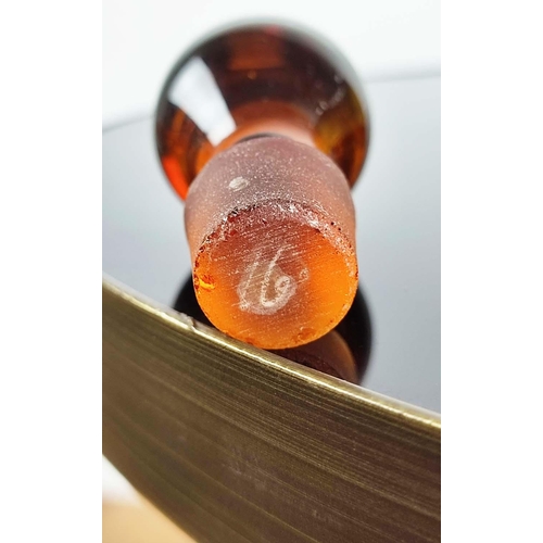 11 - VINTAGE AMBER COCKTAIL DECANTER with four glasses, with a number '16', on the base of the decanter a... 