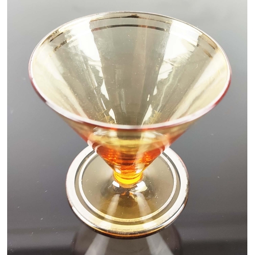 11 - VINTAGE AMBER COCKTAIL DECANTER with four glasses, with a number '16', on the base of the decanter a... 