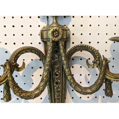 3 - WALL LIGHTS, two pairs, gilt bronze including a pair with draped swag and flamed finial urn, swagged... 