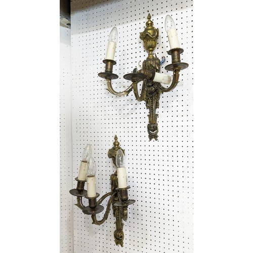 3 - WALL LIGHTS, two pairs, gilt bronze including a pair with draped swag and flamed finial urn, swagged... 