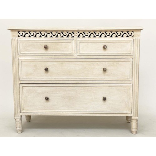 104 - COMMODE, French style traditionally grey painted with pierced frieze and four drawers, 75cm H x 89cm... 