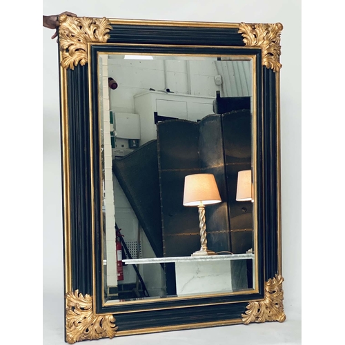 106 - WALL MIRROR, Italian style ebonised and parcel gilt with bevelled mirror and bold acanthus spandrels... 