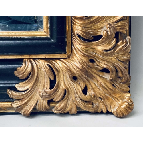 106 - WALL MIRROR, Italian style ebonised and parcel gilt with bevelled mirror and bold acanthus spandrels... 