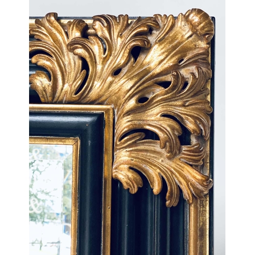 106 - WALL MIRROR, Italian style ebonised and parcel gilt with bevelled mirror and bold acanthus spandrels... 