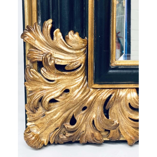 106 - WALL MIRROR, Italian style ebonised and parcel gilt with bevelled mirror and bold acanthus spandrels... 