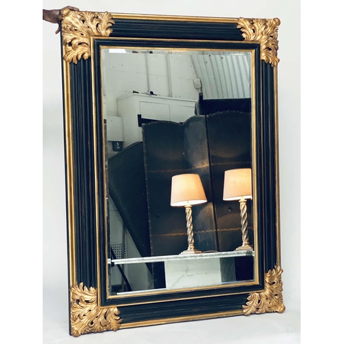 106 - WALL MIRROR, Italian style ebonised and parcel gilt with bevelled mirror and bold acanthus spandrels... 