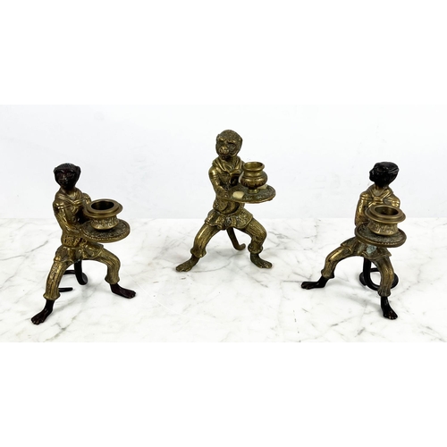 11 - ANTHROPOMORPHIC MONKEY CANDLESTICKS, a pair, and one other along with a cast bronze urn table lighte... 