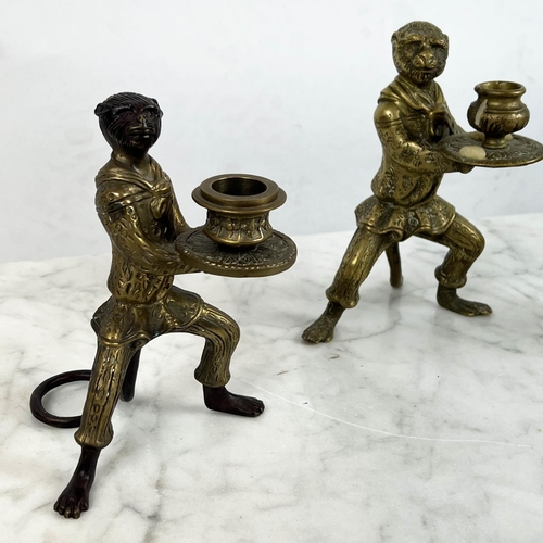 11 - ANTHROPOMORPHIC MONKEY CANDLESTICKS, a pair, and one other along with a cast bronze urn table lighte... 