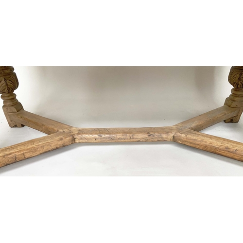 114 - DRAWLEAF EXTENDING DINING TABLE, English style oak, with notch carved frieze raised on broad carved ... 