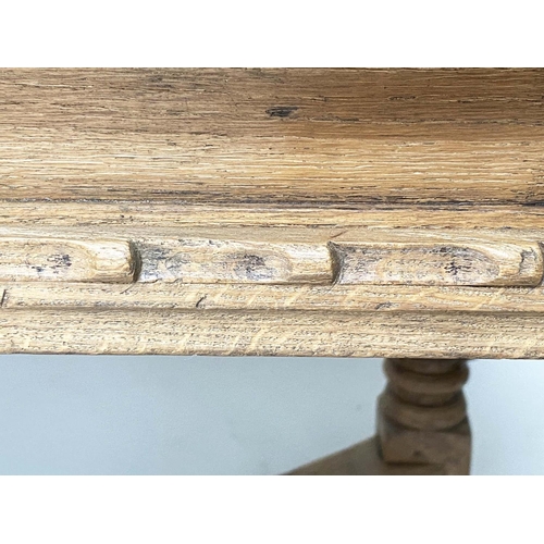 114 - DRAWLEAF EXTENDING DINING TABLE, English style oak, with notch carved frieze raised on broad carved ... 