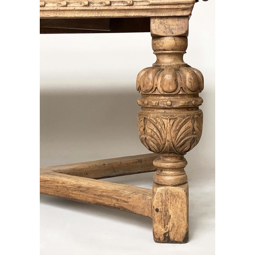 114 - DRAWLEAF EXTENDING DINING TABLE, English style oak, with notch carved frieze raised on broad carved ... 