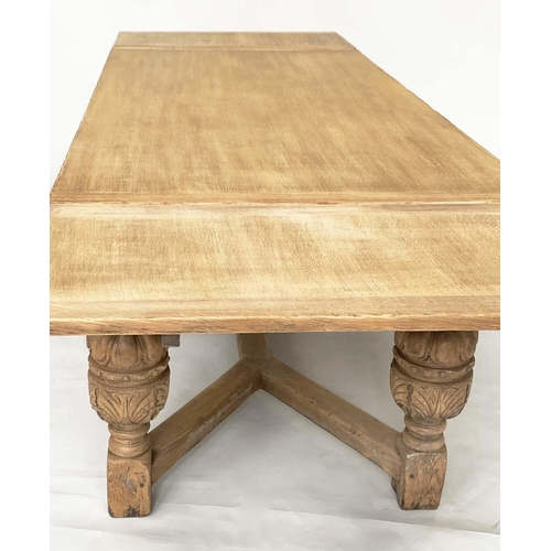 114 - DRAWLEAF EXTENDING DINING TABLE, English style oak, with notch carved frieze raised on broad carved ... 