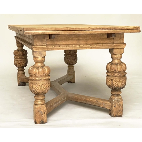 114 - DRAWLEAF EXTENDING DINING TABLE, English style oak, with notch carved frieze raised on broad carved ... 