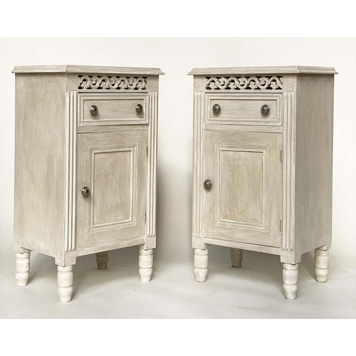 116 - BEDSIDE CABINETS, a pair, French traditionally grey painted with drawer, panelled door and pierced f... 