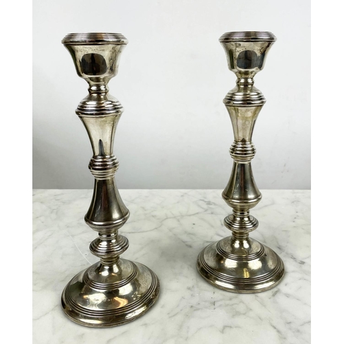 13 - SILVER CANDLESTICKS, a pair, Birmingham 1977, a silver sauce boat, Jay and Richard Attenborough Co L... 