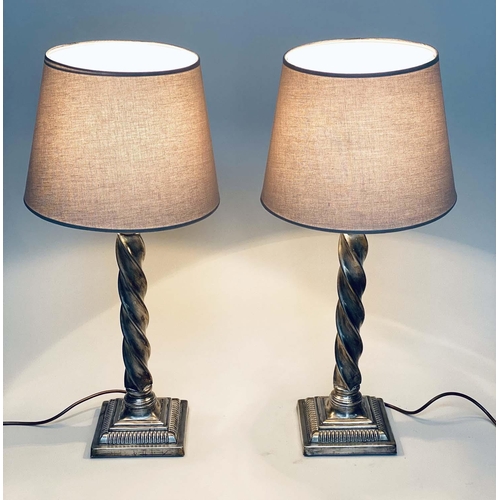 95 - TABLE LAMPS, a pair, silvered metal twist columns and plinth bases, with shades, 64cm H. (2)