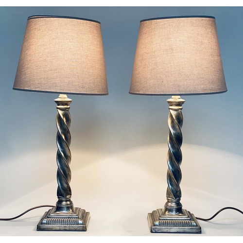 95 - TABLE LAMPS, a pair, silvered metal twist columns and plinth bases, with shades, 64cm H. (2)