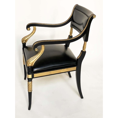 97 - ARMCHAIRS, a pair, Regency style lacquered and gilded with leather seats scroll arms and swept front... 