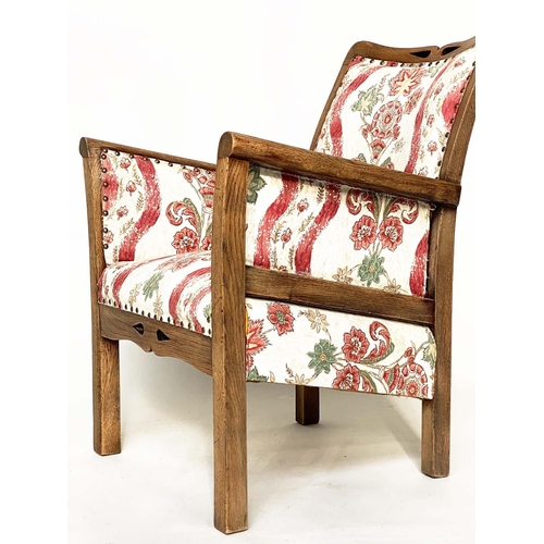 99 - ELBOW/ARMCHAIRS, a pair, early 20th century Arts and Crafts style pierced oak framed with old Englis... 