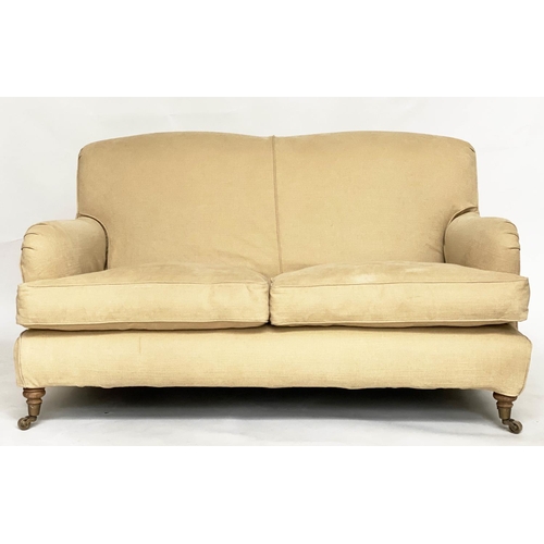 85 - SOFA, Howard style with rounded backs and arms and shaped sides with close fitting yellow linen loos... 