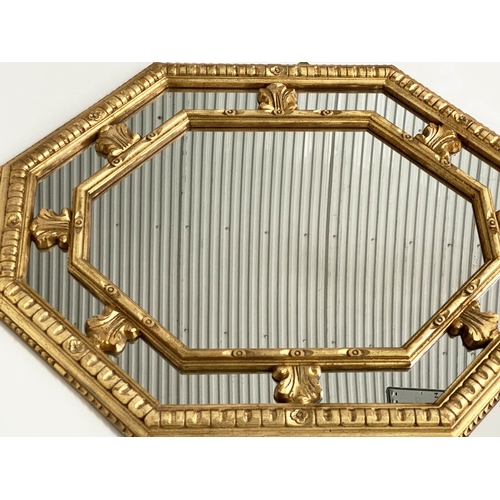 89 - WALL MIRROR, Italian style octagonal foliate gilded with marginal mirror plates, 94cm H x 77cm.