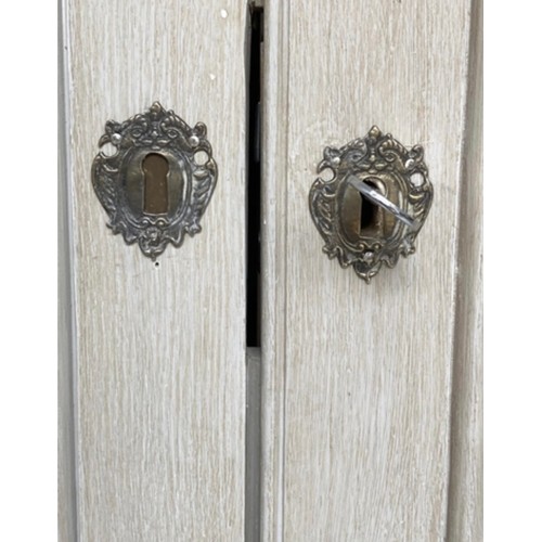 115 - ARMOIRE, French style traditionally grey painted with two panelled doors, enclosing hanging space, 2... 