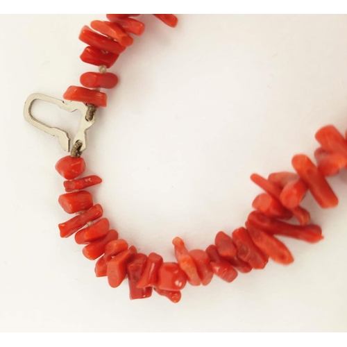 42 - A RED CORAL DOUBLE STRAND NECKLACE, 36cm long, a carnelian single strand bead necklace, 64cm long, p... 