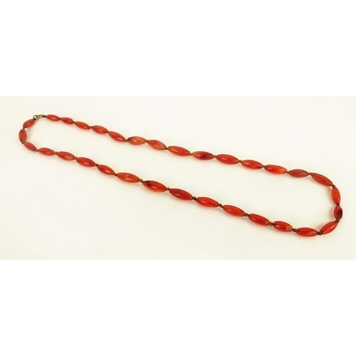 42 - A RED CORAL DOUBLE STRAND NECKLACE, 36cm long, a carnelian single strand bead necklace, 64cm long, p... 