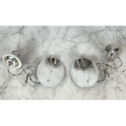 52 - DUTCH SILVER WALL SCONES, a pair, single arm with swag detail having an oval back plate, with engrav... 