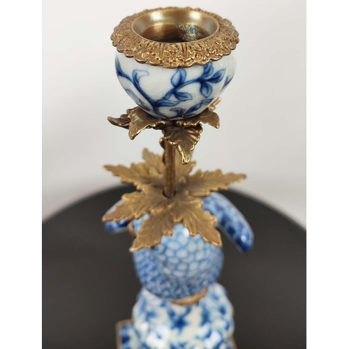 597 - CANDELABRA, a pair, in the form of parrots, blue and white ceramic, gilt mounts, 48.5cm H. (2)